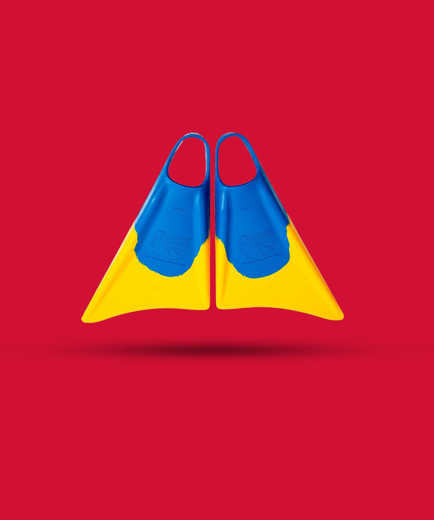 Blue and yellow swimfins against red background, showcasing durable design for swimming