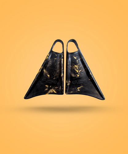 Black and gold 90th anniversary swimfins with Churchill branding on orange background