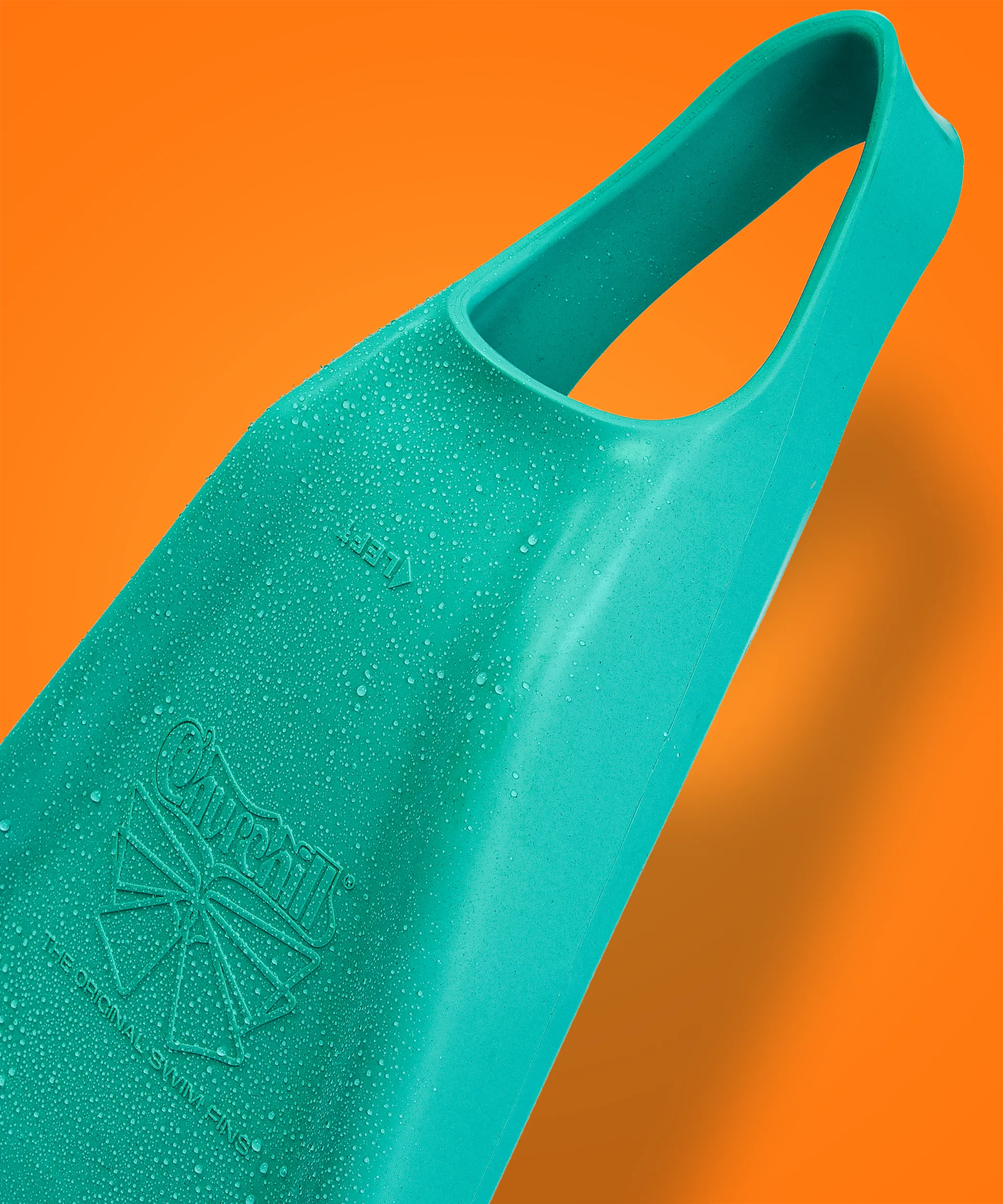 Teal Churchill swimfin with water droplets, orange background, left foot marking