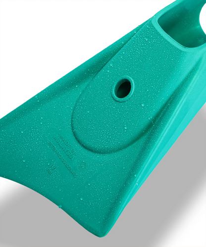 Teal swimfin with water droplets, showing size M and Malaysia manufacturing details