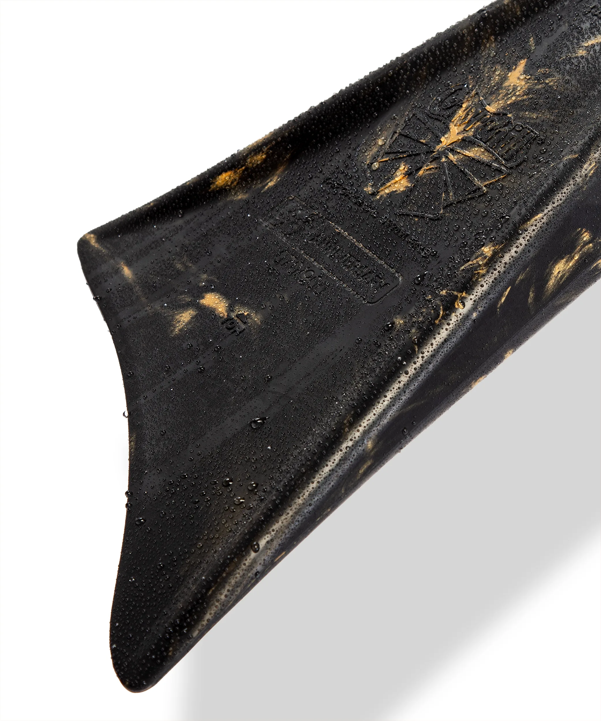 Black and gold swimfin with water droplets, featuring textured grip and embossed logo for aquatic performance.