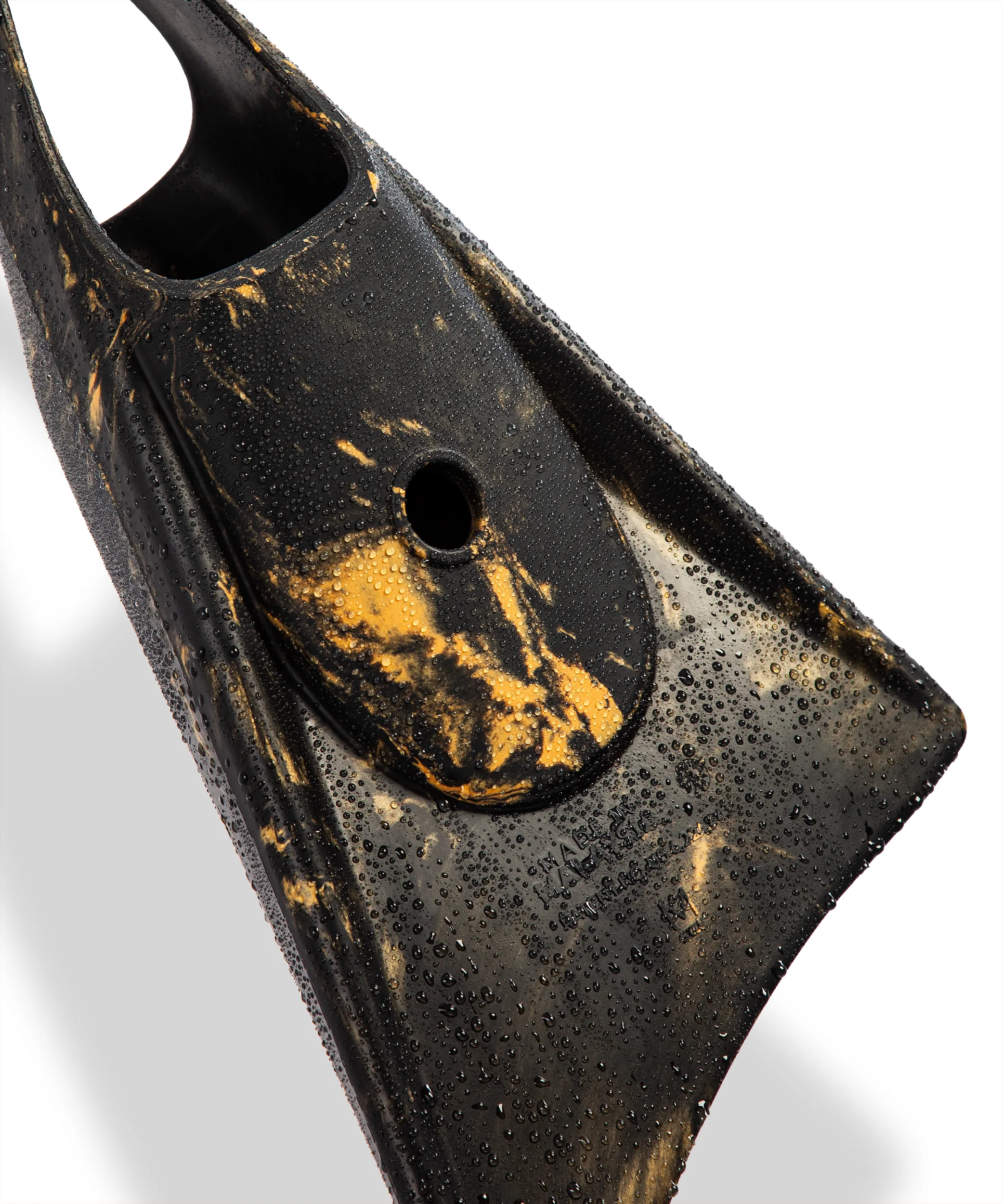 Black and gold swimfin with water droplets, showcasing durable design for swimming and diving