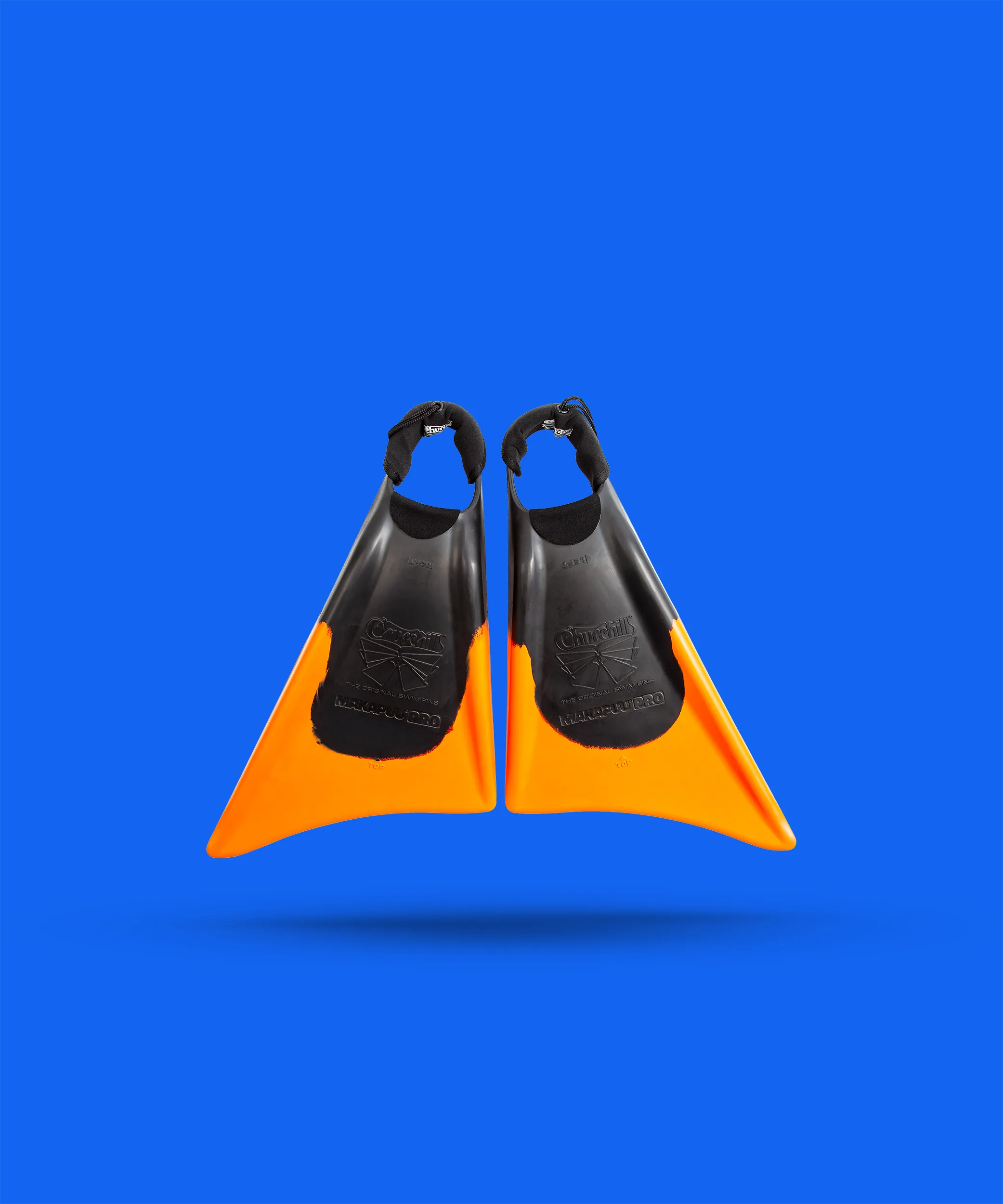 Orange and black Churchill Makapuu Pro swim fins on blue background