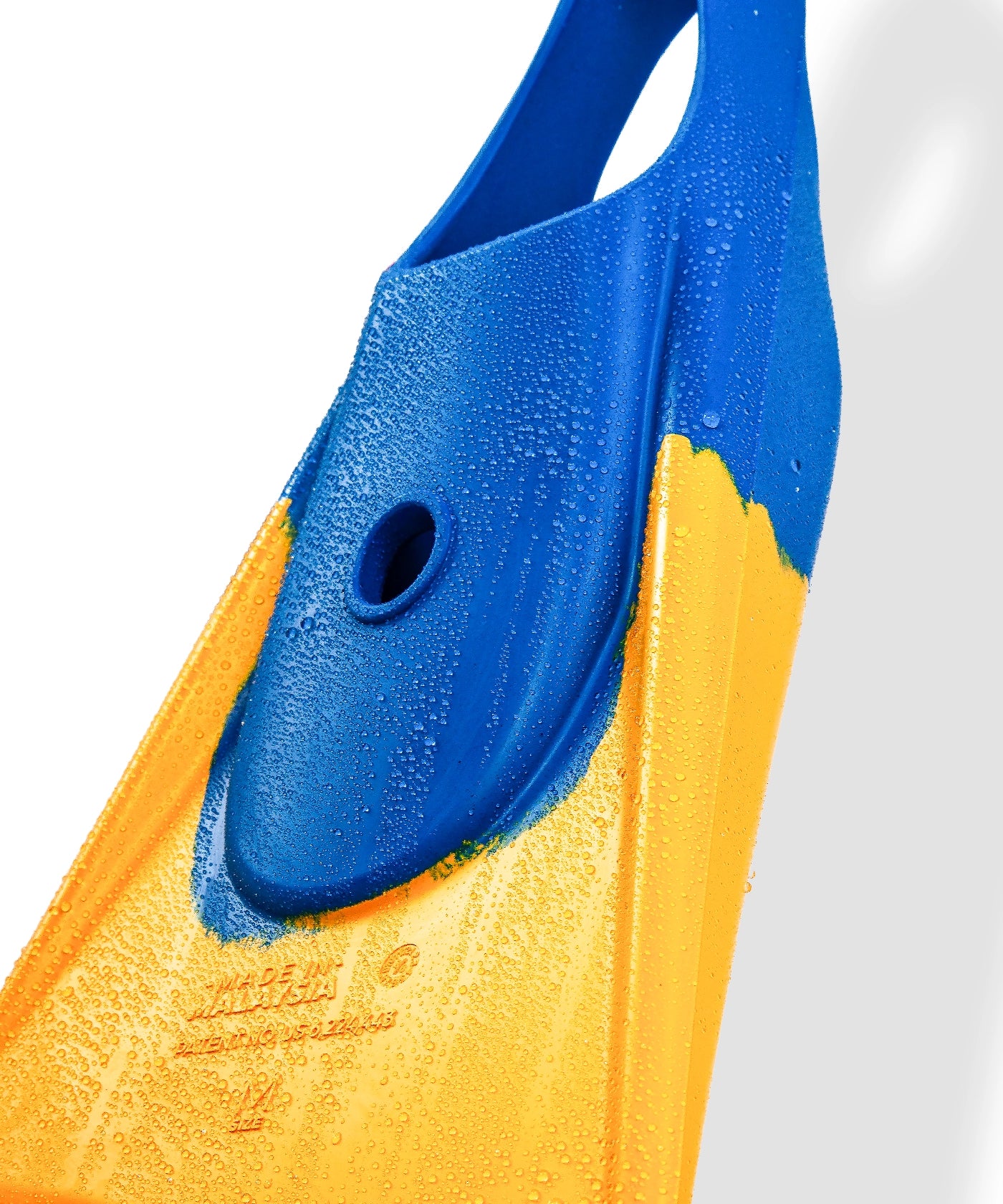Blue and yellow swimfin with water droplets, showcasing durable design for swimming