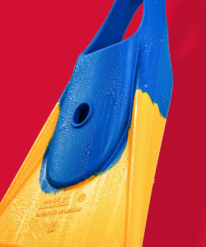 Blue and yellow swimfin with water droplets, showcasing durable design for swimming.